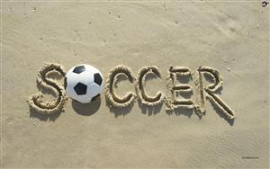 Soccer ball on beach